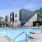 a swimming pool with a building in the background