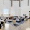 a large living room with a large dining table and a large window